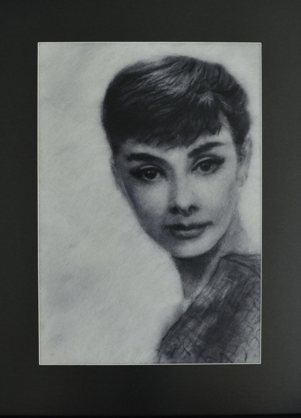 Portrait of Audrey Hepburn made of merino wool. Wool Art Gallery